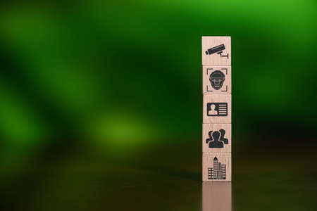 Concept of CCTV with icons on wooden cubes