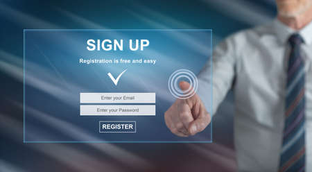 Man touching a signup concept on a touch screen with his fingerの写真素材