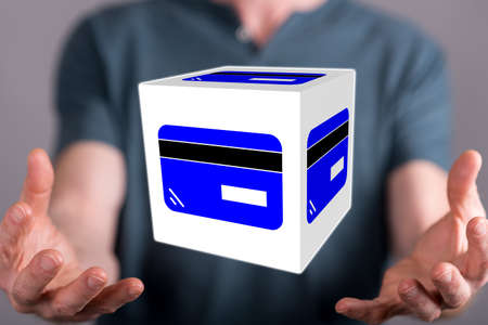 Credit card concept between hands of a man in background