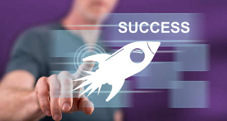 Man touching a success concept on a touch screen with his fingerの写真素材