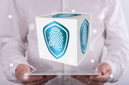 Fingerprint security system concept above a tablet held by a man in background
