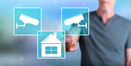 Man touching a security camera concept on a touch screen with his finger