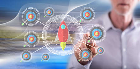 Man touching a business target concept on a touch screen with his finger