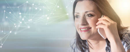 Young attractive woman talking on mobile phone at home; panoramic banner