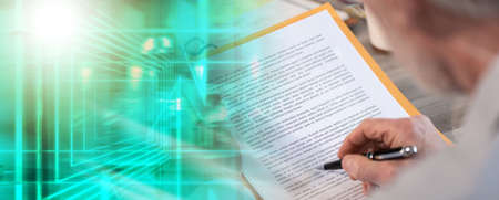 Businessman checking a document in office; multiple exposure