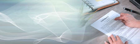 Female hands checking content of a contract; panoramic banner