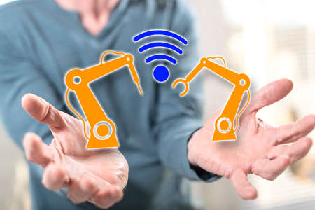 Industry 4.0 concept above the hands of a man in background