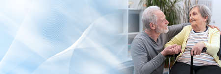 Portrait of old mother supported by her son; panoramic bannerの写真素材
