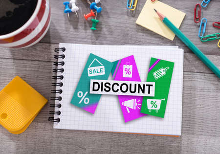 Discount concept drawn on a notepad placed on a deskの写真素材