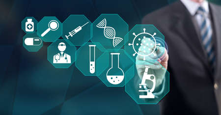 Man touching a medical research concept on a touch screen with a stylus pen