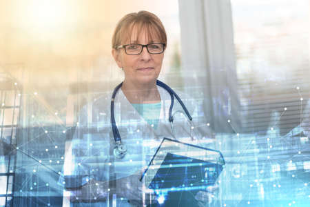 Portrait of female doctor standing and holding a medical textbook; multiple exposure