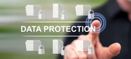 Man touching a data protection concept on a touch screen with his fingerの写真素材