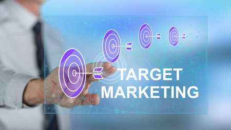 Man touching a target marketing concept on a touch screen with his fingerの写真素材