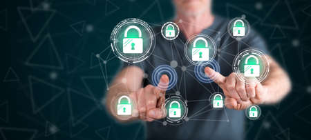 Man touching a network safety concept on a touch screen with his fingers