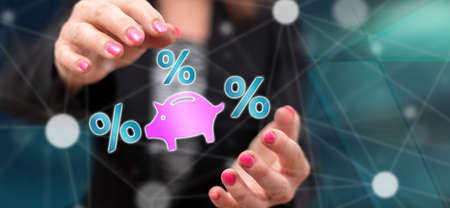 Interest rates concept between hands of a woman in background