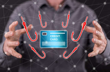 Phishing concept between hands of a man in backgroundの写真素材