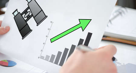 Hands holding a paper showing a business perspective concept