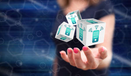 Smart speaker concept above the hand of a woman in background
