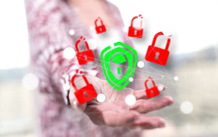 Cyber security concept above the hand of a woman in background