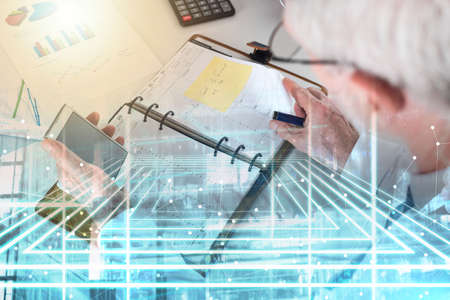 Businessman taking an appointment at office; multiple exposure