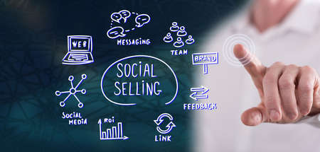 Man touching a social selling concept on a touch screen with his fingerの写真素材