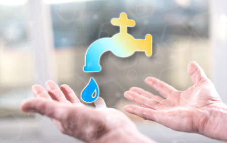 Water leak concept above the hands of a man