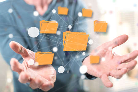 Data exchange concept above the hands of a man in backgroundの写真素材