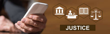Hand holding mobil phone with justice concept on background