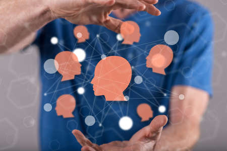 Social network concept between hands of a man in background