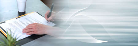 Businesswoman signing a contract; panoramic banner