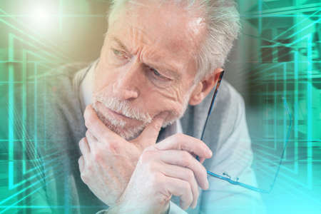 Portrait of pensive senior businessman; multiple exposureの写真素材
