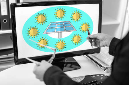 Businesswoman showing clean energy concept on a computer screen