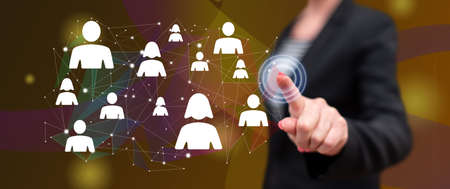 Woman touching a social network concept on a touch screen with her finger