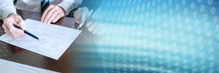 Business people working on a business plan; panoramic banner