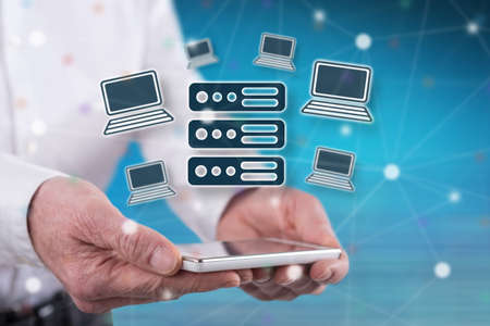 Hosting concept above a smartphone held by hands