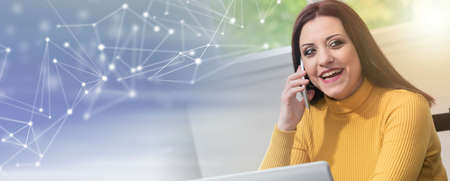 Portrait of young businesswoman working from home; panoramic banner