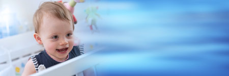Portrait of happy cute baby girl with a beautiful smile; panoramic banner