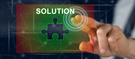 Man touching a solution concept on a touch screen with his fingerの写真素材