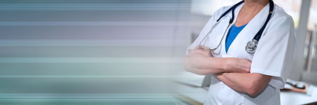 Female doctor with arms crossed in medical office; panoramic bannerの写真素材
