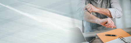 Motivated businessman rolling up his sleeves; panoramic banner