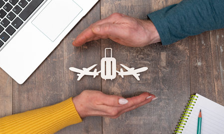 Concept of baggage insurance with hands in a protective gestureの写真素材