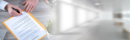 Hand of businessman signing a contract; panoramic bannerの写真素材
