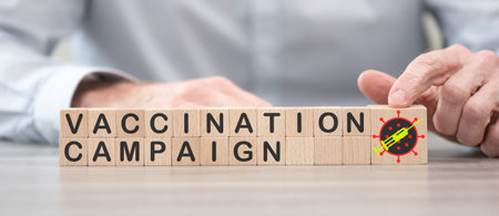 Concept of vaccination campaign on wooden cubesの写真素材