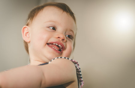 Portrait of happy cute baby girl with a beautiful smile