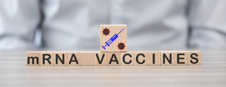 Concept of mRNA vaccines on wooden cubesの写真素材