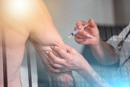 Doctor injecting vaccine in arm of patient; multiple exposureの写真素材