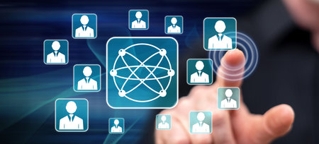 Man touching a social media network concept on a touch screen with his finger