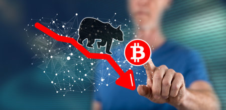 Man touching a bitcoin bearish trend concept on a touch screen with his fingerの写真素材