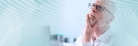 Portrait of thoughtful senior businessman; panoramic banner