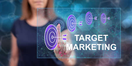 Woman touching a target marketing concept on a touch screen with her fingerの写真素材